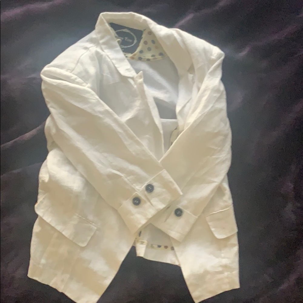 A white colored lightweight blazer.